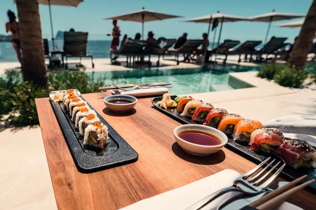 Outdoor dining table by the pool side.