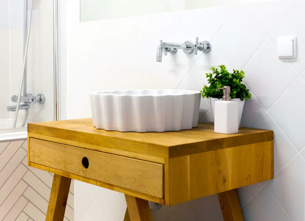 A small wooden bathroom vanity.